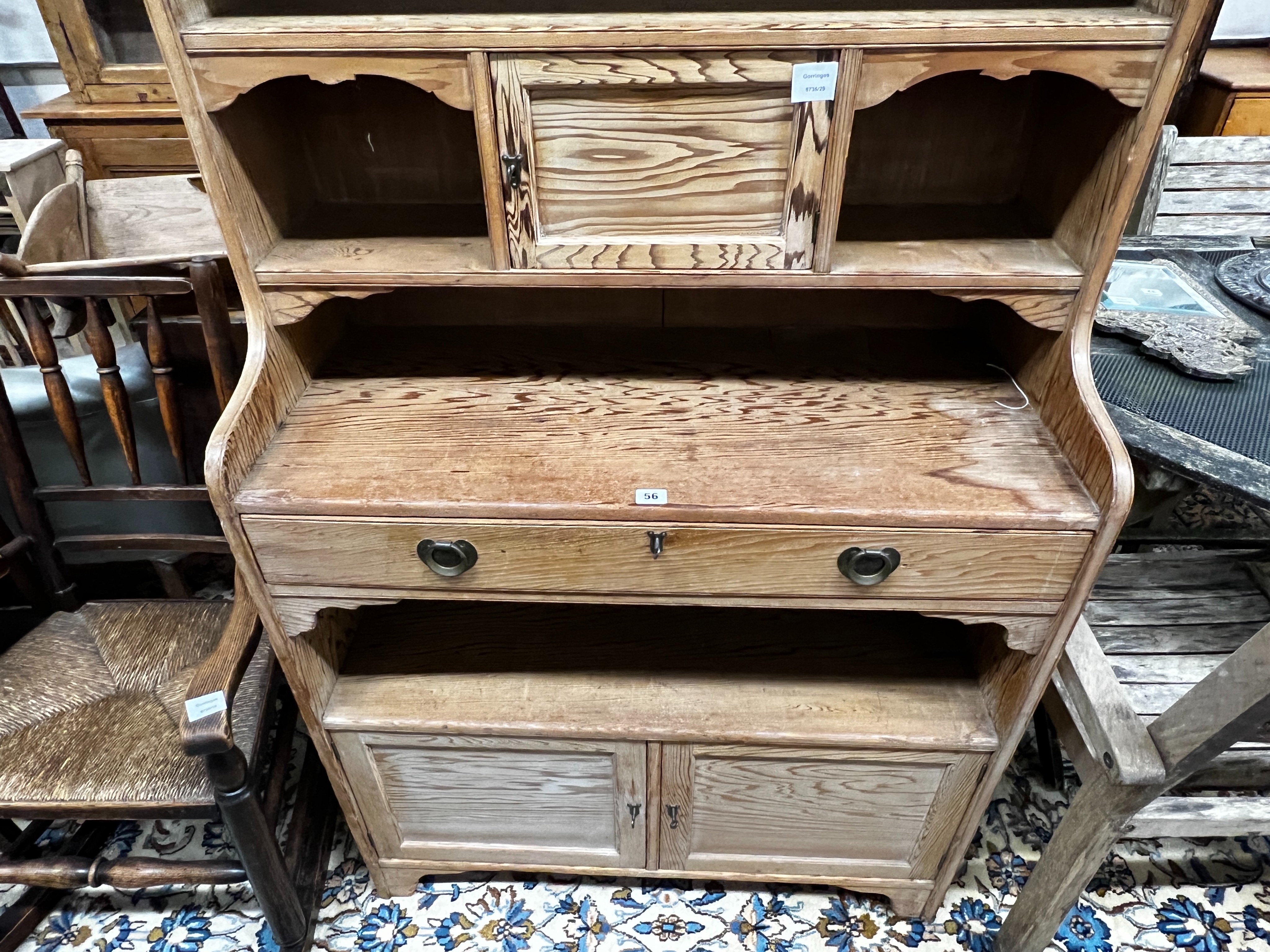 An Arts & Crafts pitch pine dresser with secretaire drawer, length 92cm, depth 41cm, height 220cm